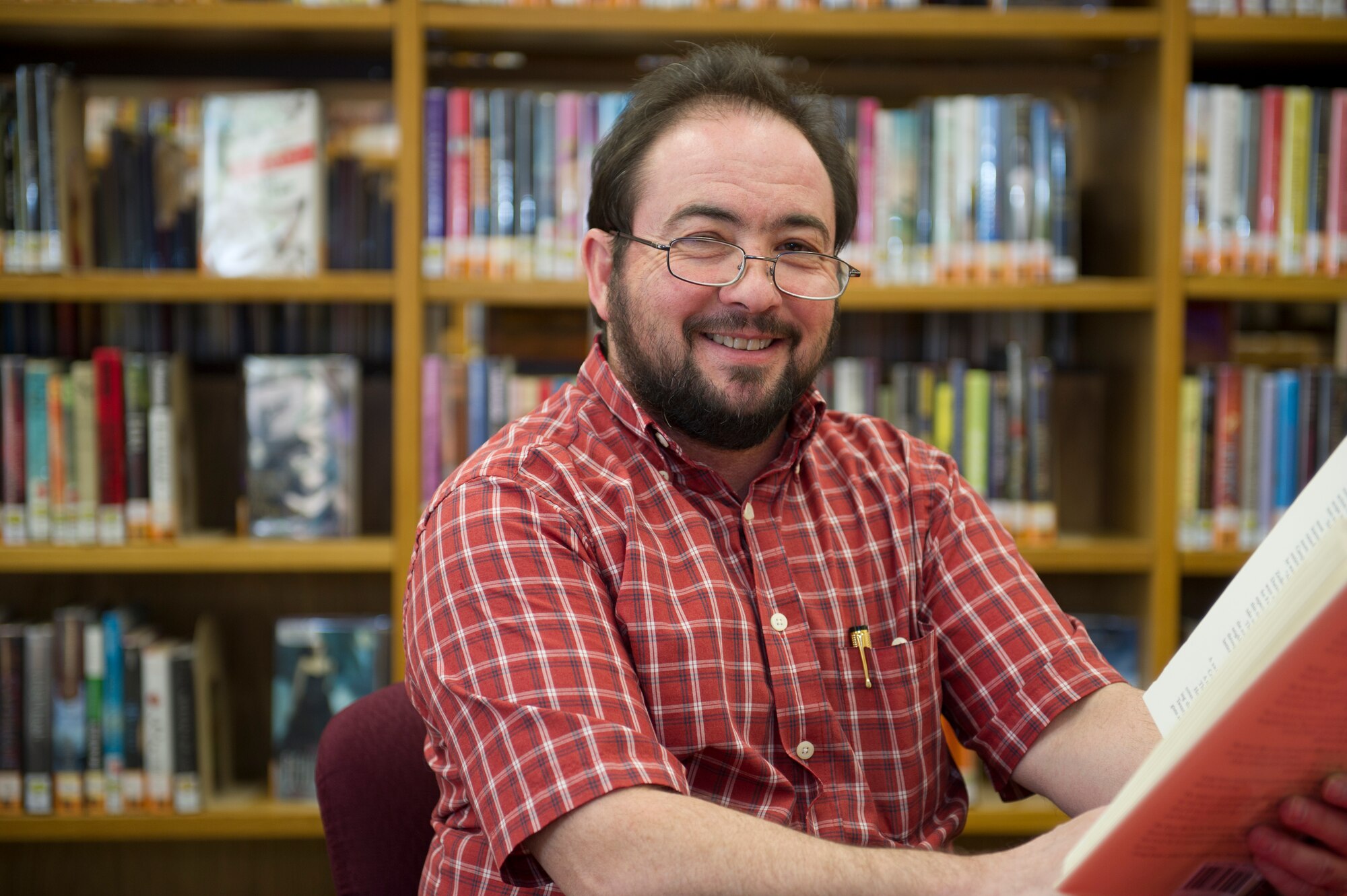 HOLLOMAN AIR FORCE BASE, N.M. – Steve Haydu, director of the Ahrens Memorial Library, reads a book here March 1. The library offers a variety of learning tools to boost morale and support education on base. (U.S. Air Force photo by Airman 1st Class Daniel E. Liddicoet/Released)