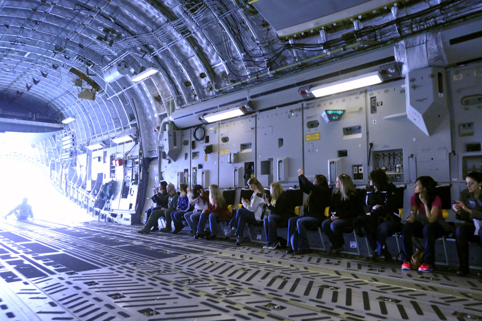 Spouses of the 62nd Operations Group view the surrounding area of Mt. Rainier while flying on a C-17 Globemaster III April 14, 2012, at Joint Base Lewis-McChord, Wash. The 62nd OG hosted an orientation flight to show their appreciation for their spouses. (U.S. Air Force photo/Staff Sgt. Frances Kriss)
