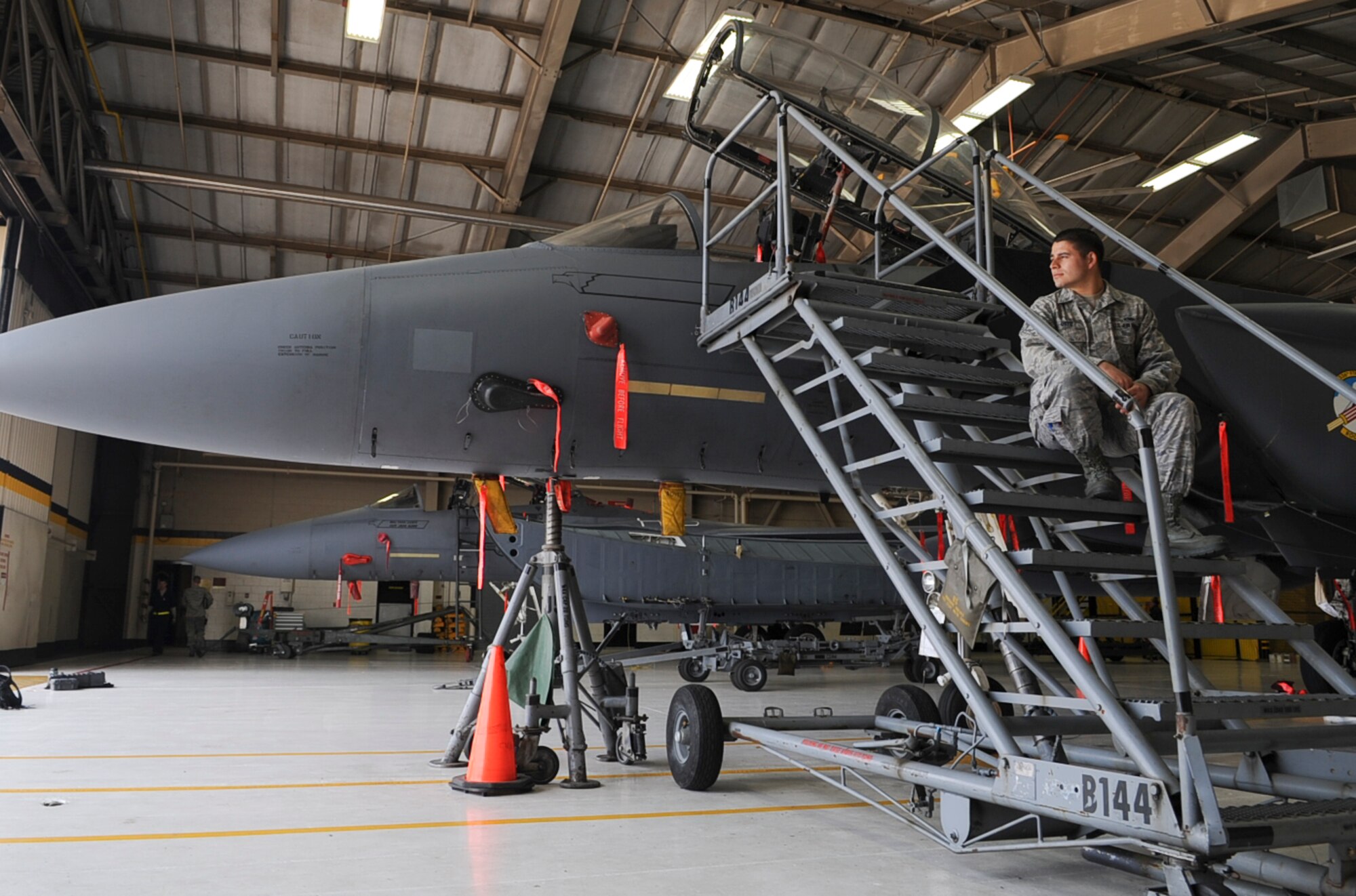 U.S. Air Force Senior Airman Heber Ortiz takes a break during a 10-hour shift in preparation for an April 16 training mission on Seymour Johnson Air Force Base, N.C., April 13, 2012. Maintainers from the 4th Aircraft Maintenance Squadron perform daily inspections and repairs of the aircraft. Ortiz, 334th Aircraft Maintenance Unit crew chief, hails from Pueblo, Colo. (U.S. Air Force photo/Airman 1st Class Aubrey Robinson/Released)