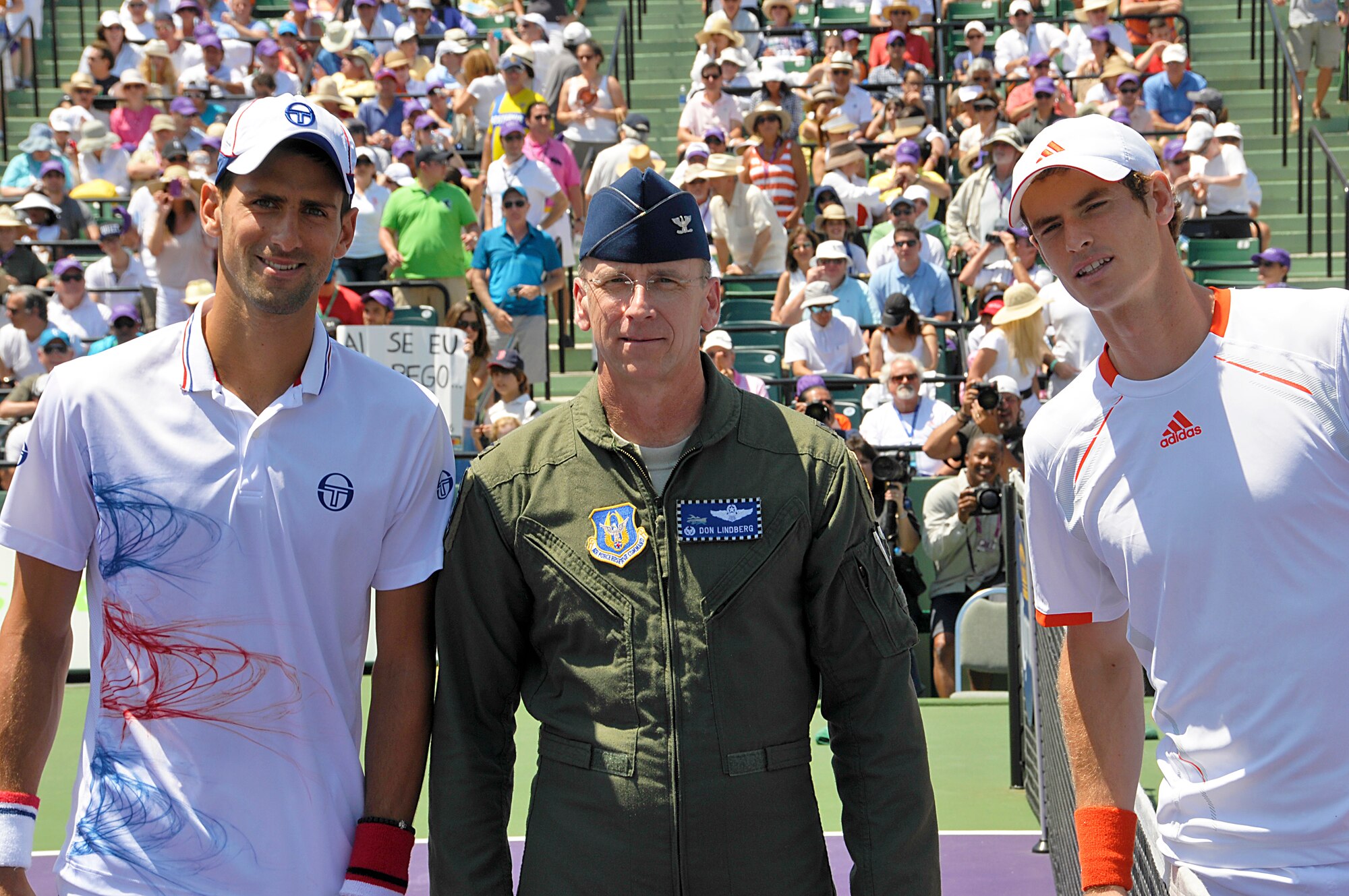Colonel Donald R. Lindberg, Commander,482nd Fighter Wing poses for a photo with players Novak Djokovic and Andy Murray after tossing the game-opening coin at the Sony Ericsson Open Tennis Tournament  Men's Final, Apr. 1.