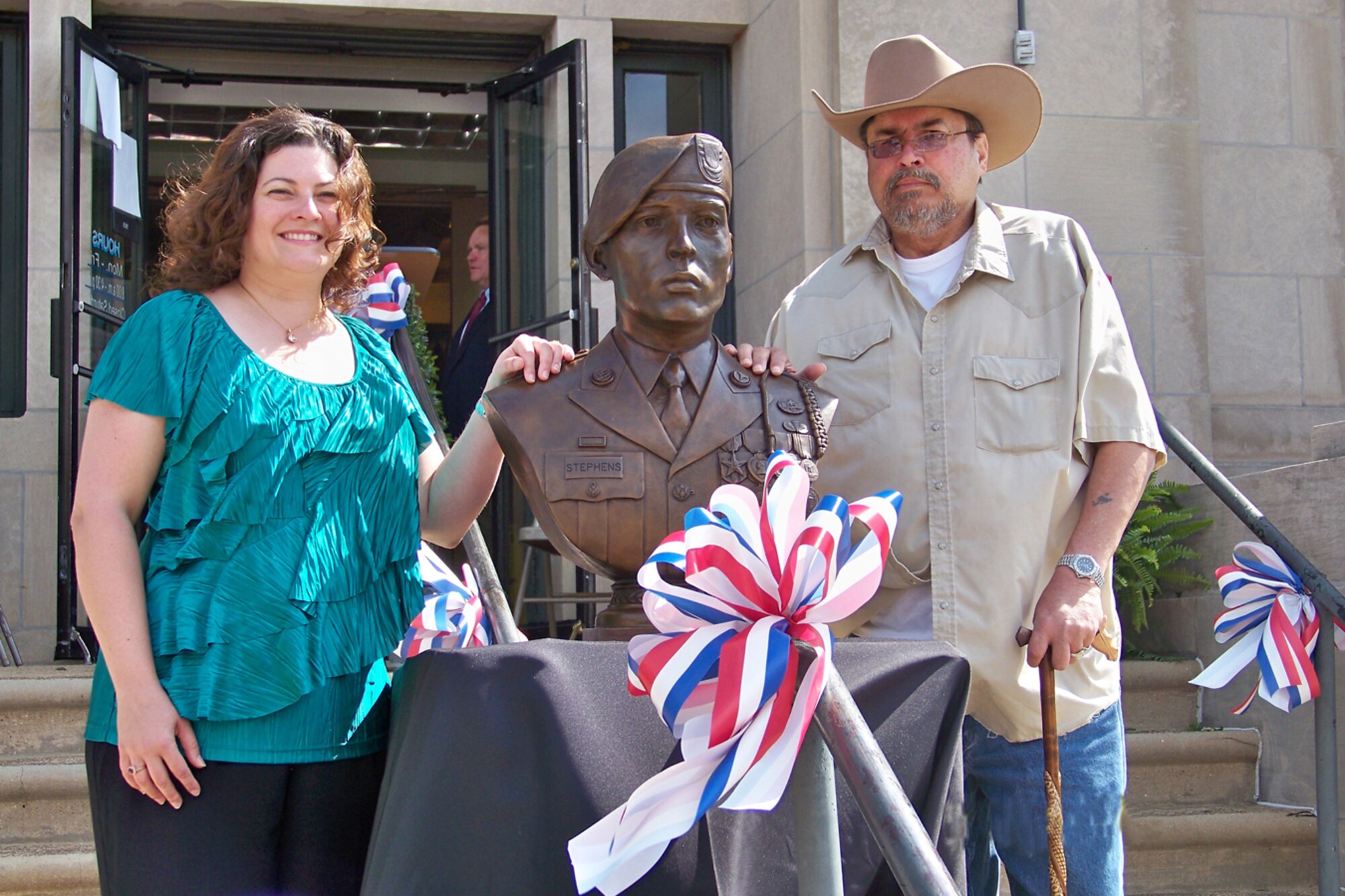 From left, Shalene Shmidt and David Stephens, the sister and father of Sgt. Alex Stephens, stand next to an Operation Never Forget bust of the fallen Army field medic who was honored in a ceremony in front of the Franklin County courthouse April 14. Stephens, a native of Franklin County, was assigned to the 2nd Battalion, 508th Parachute Infantry Regiment, 4th Brigade Combat Team, 82nd Airborne Division, Fort Bragg, N.C. Mike Cunningham, ATA branch manager for human resources, who initiated the process to get Stephens recognized for his sacrifice and military service, spoke at the unveiling.  AEDC Commander Col. Michael Brewer, Pat Eagan, ATA support services director, and Dave Uselton, ATA material control supervisor, also spoke at the event.  Uselton is an Operation Never Forget (ONF) co-founder and is the ONF regional director.  (Photo provided)
