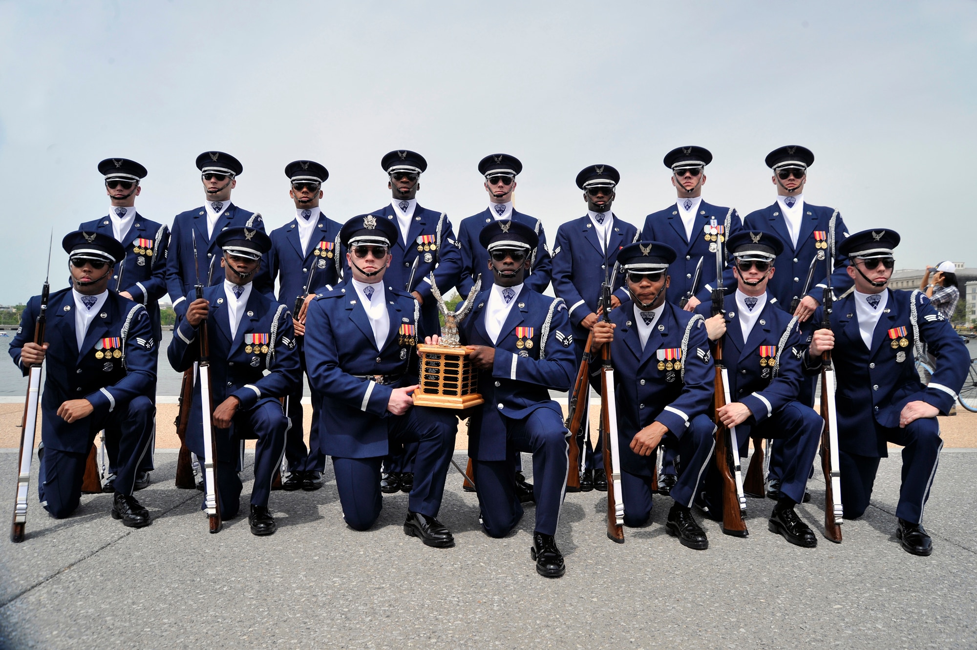 The United States Air Force Honor Guard Drill Team poses with their first-place trophy after winning the Joint Service Drill Exhibition on April 14 at the Jefferson Memorial in Washington, D.C. Drill teams from all four branches of the American armed services competed at the event.  (U.S. Air Force Photo/Senior Airman Perry Aston)