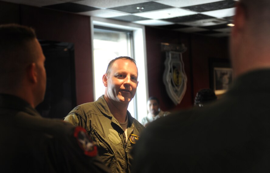 U.S. Air Force Col. Christopher Short, 23d Wing vice commander, talks with family and friends at Moody Air Force Base, Ga., April 13, 2012. After returning from his fini-flight, Short enjoyed food and refreshments alongside friends and family. (U.S. Air Force photo by Airman 1st Class Douglas Ellis/Released)
