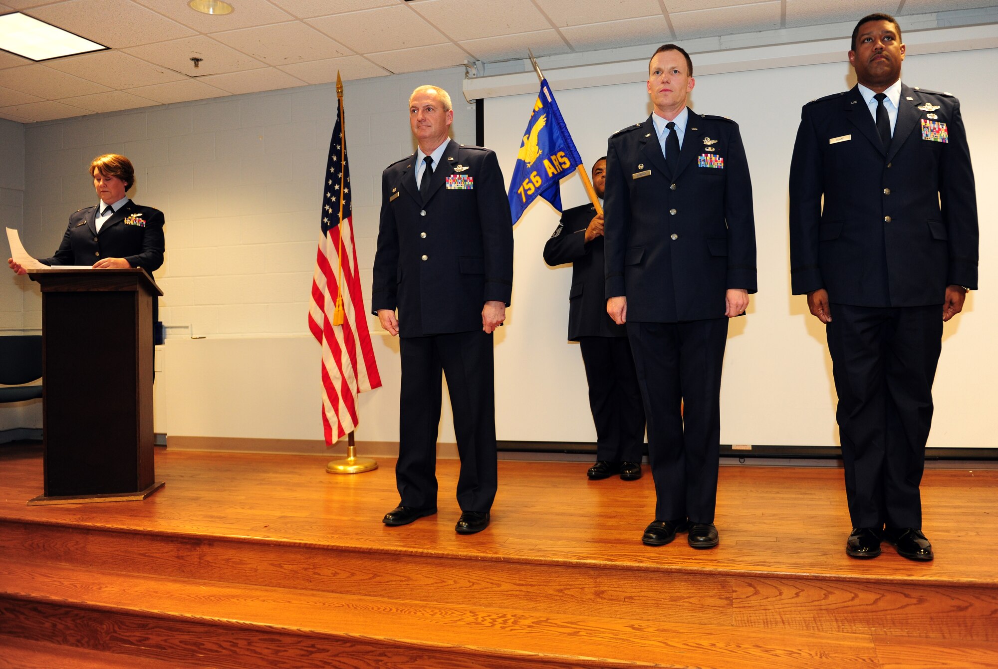 JOINT BASE ANDREWS, Md. -- Lt. Col. Brian Davis, 459th Operations Group commander passes the guidon to Lt. Col. Robert Blake, 756th Air Refueling Squadron commander during a change of command ceremony here, April 14, 2012.  Preceding Blake in leadership is Lt. Col. Mark Deresky, 756th ARS wing commander. (U.S. Air Force photo/Senior Airman Amber Russell)