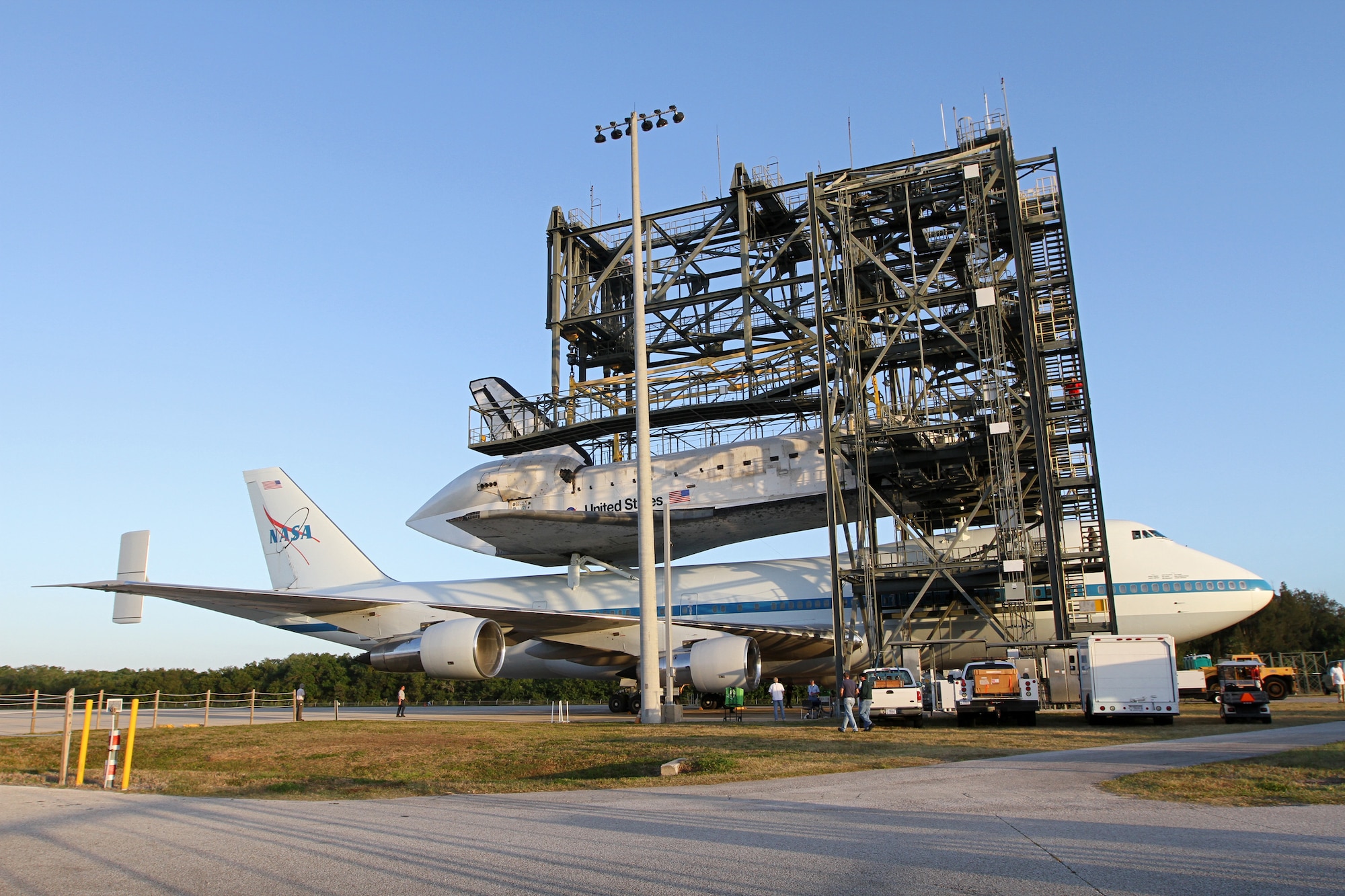 Preparations are under way for the Shuttle Carrier Aircraft carrying space shuttle Discovery to back out of the Shuttle Landing Facility's mate-demate device at NASA's Kennedy Space Center in Florida. The device, known as the MDD, is a large gantry-like steel structure used to hoist a shuttle off the ground and position it onto the back of the aircraft, or SCA. The SCA is a Boeing 747 jet that was originally manufactured for commercial use and modified by NASA to transport the shuttles between destinations on Earth. This SCA, designated NASA 905, is assigned to the remaining ferry missions, delivering the shuttles to their permanent public display sites. NASA 905 is scheduled to ferry Discovery to the Washington Dulles International Airport in Virginia on April 17, after which the shuttle will be placed on display in the Smithsonian's National Air and Space Museum Steven F. Udvar-Hazy Center. For more information on the SCA, visit http://www.nasa.gov/centers/dryden/news/FactSheets/FS-013-DFRC.html. For more information on shuttle transition and retirement activities, visit http://www.nasa.gov/transition. (Photo by/NASA Kim Shiflett)