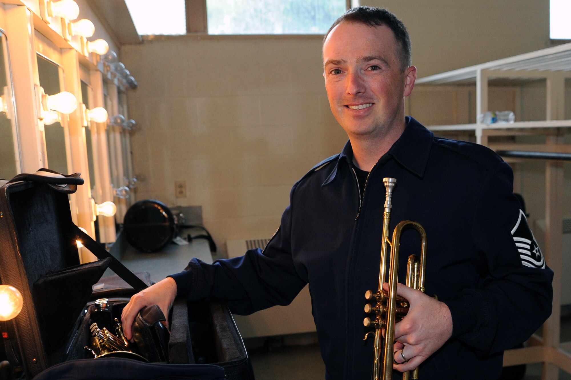 Master Sgt. Brian MacDonald, trumpet player with The USAF Band’s premier jazz ensemble Airmen of Note, gets ready to rehearse in the dressing room before a concert at Willett Hall in Portsmouth, Va., April 12. “The Note” are on tour playing concerts throughout Virginia, North Carolina, South Carolina and Georgia. (U.S. Air Force photo by Lynda Valentine)