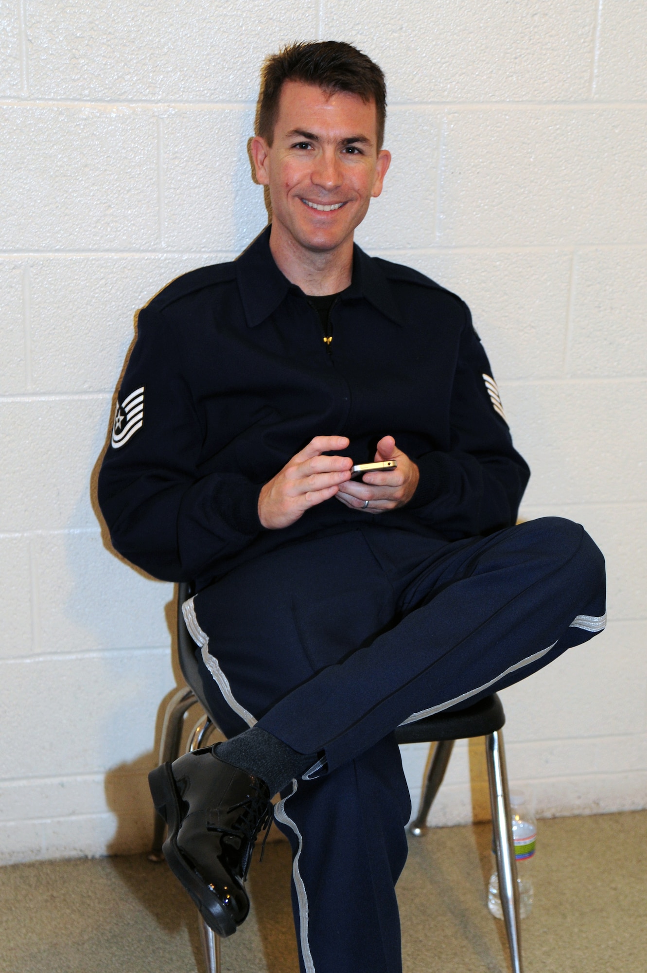 Airmen of Note saxophone player Tech. Sgt. Tyler Kuebler finds a quiet place to relax backstage at Willett Hall in Portsmouth, Va., April 12. The Airmen of Note are on an 18-concert tour throughout Virginia, North Carolina, South Carolina and Georgia. (U.S. Air Force photo by Lynda Valentine)