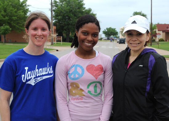 Top finishers in the women’s division of the “Well and Aware” 5K-run and one-mile walk April 10 at the Fitness Center, Vance Air Force Base, Okla., were, left to right: first place, Lt. Col. Michelle Pryor, commander of the 32nd Flying Training Squadron; second place, Airman 1st Class Asia Moore, a logistics planner with the 71st Logistics Readiness Squadron; and third place, Magda Caballero, wife of Maj. Gerardo Caballero, assistant operations officer with the 8th Flying Training Squadron. (U.S. Air Force photo/ Airman 1st Class Frank John Casciotta)