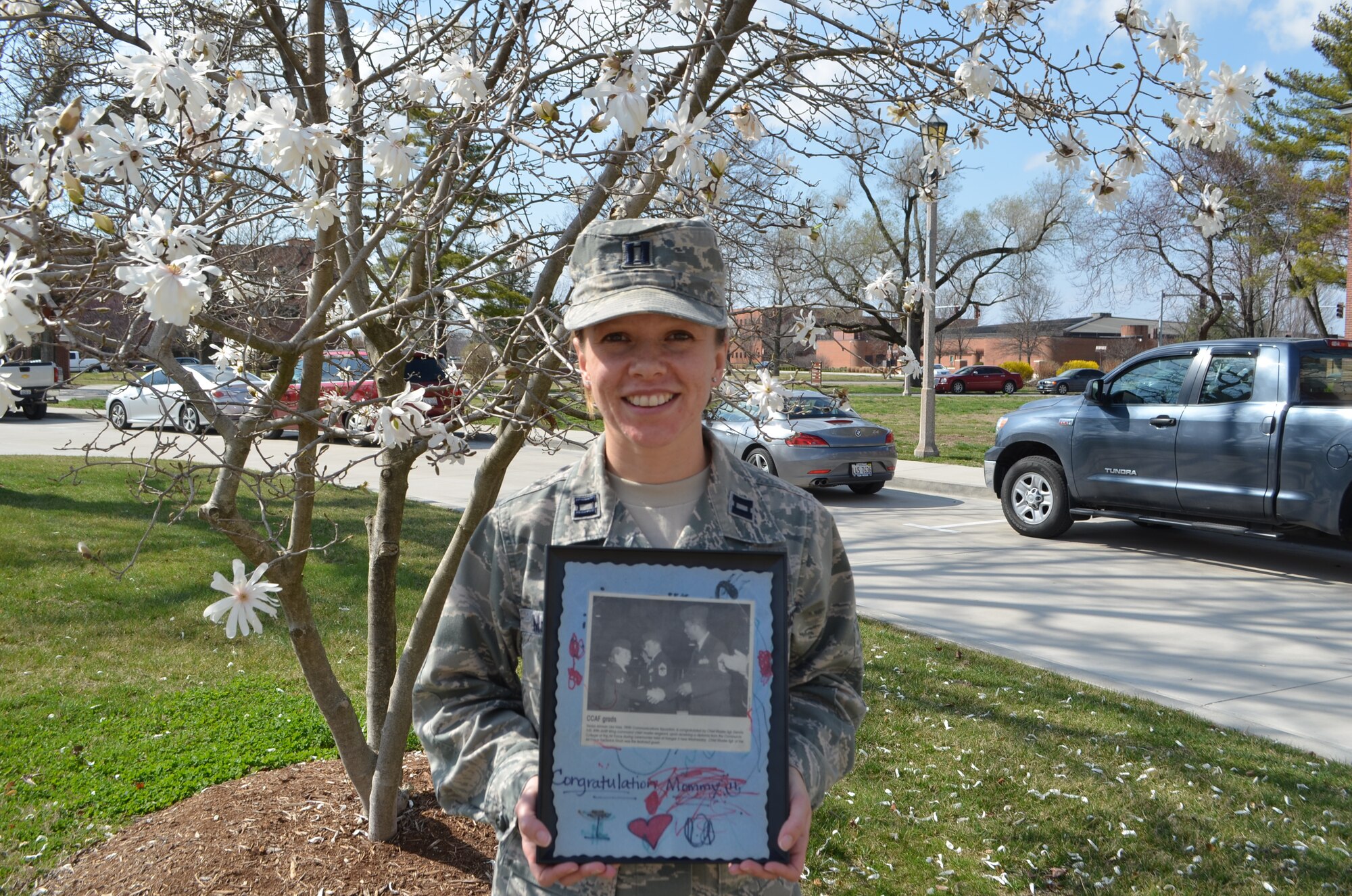 Capt. Lisa McLean, 18th Air Force and 618th Air and Space Operations Center (Tanker Airlift Control Center) section commander, used the Airman Scholarship and Commissioning Program to earn her education and transition from an enlisted Airman to an officer. Once McLean started her education, she found she does not want to stop. (U.S. Air Force photo by Senior Airman Amber R. Kelly-Herard) 