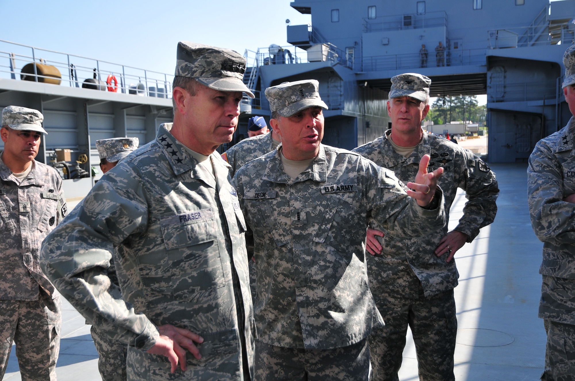 U.S. Army Chief Warrant Officer Patrick Deck, right, detachment commander of the 1099th Transportation Detachment (Logistics Support Vessel) explains the specifications of an LSV to U.S. Air Force Gen. William Fraser, head of the U.S. Transportation Command, during a visit to Fort Eustis’ 3rd Port, April 9. Fraser came to personally award 22 soldiers with the Joint Service Achievement Medals for their role in Operation Deep Freeze, a yearly operation to support the science and research activities conducted by the U.S. Antarctic Program. (U.S. Army photo by Sgt. Edwin Rodriguez/Released)