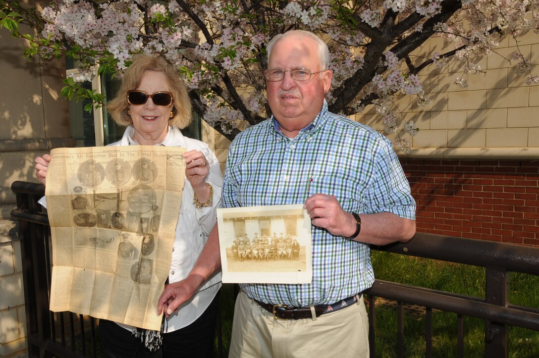 Dr. and Mrs. Seward hold a copy of The Tennessean from 1923 and a photo of Lieutenant J.A. Seward when he was with the 105th Squadron in the 1920s.
 
(Photo by MSgt Julius Shook, 118th Air Wing/Public Affairs.)