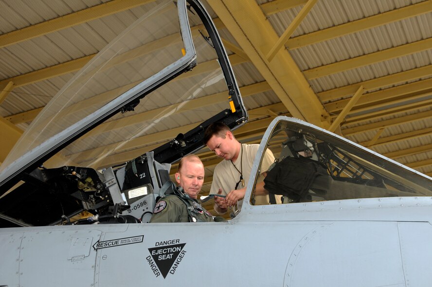 Senior Airman Brad Allen, a crew chief with the 188th Aircraft Maintenance Squadron, helps strap Col. Tom Anderson into an A-10C Thunderbolt II prior to ignition in preparation for Anderson’s “fini flight” April 12, 2012. Anderson’s final flight in the A-10 preceded a change-of-command ceremony in which he relinquished command of the 188th April 14. Anderson served as the 188th Fighter Wing commander from 2008-2012. During his career, Anderson accumulated more than 2,500 flying hours in the A-10, F-16 Fighting Falcon, T-38 and T-37 aircraft. (National Guard photo by Senior Master Sgt. Dennis Brambl/188th Fighter Wing Public Affairs)