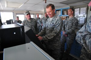 U.S. Air Force Gen. William Fraser, head of the U.S. Transportation Command, takes the reins of a bridge aboard the Army Logistics Support Vessel - 4, the Gen. William B. Bunker, during a visit to Fort Eustis’ 3rd Port, April 9. Fraser came to personally award 22 soldiers with the Joint Service Achievement Medals for their role in Operation Deep Freeze, a yearly operation to support the science and research activities conducted by the U.S. Antarctic Program. (U.S. Army photo by Sgt. Edwin Rodriguez/Released)