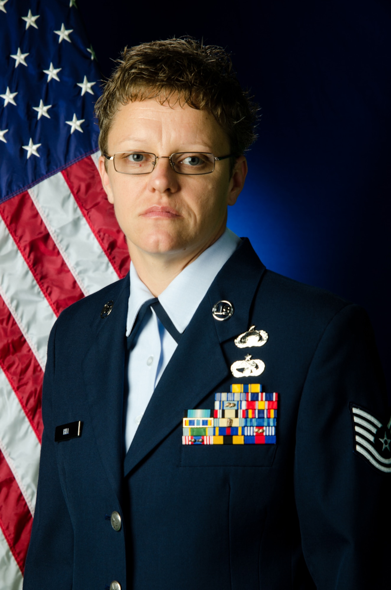 Tech. Sgt. Jennifer Hill, a crew chief with the 139th Maintenance Group, poses for a portrait at Rosecrans Air National Guard Base, St. Joseph, Mo., April 14, 2012. Hill was named the 139th Maintenance Airman of the Quarter. (U.S. Air Force photo by Senior Airman Kelsey Stuart/Missouri Air National Guard)