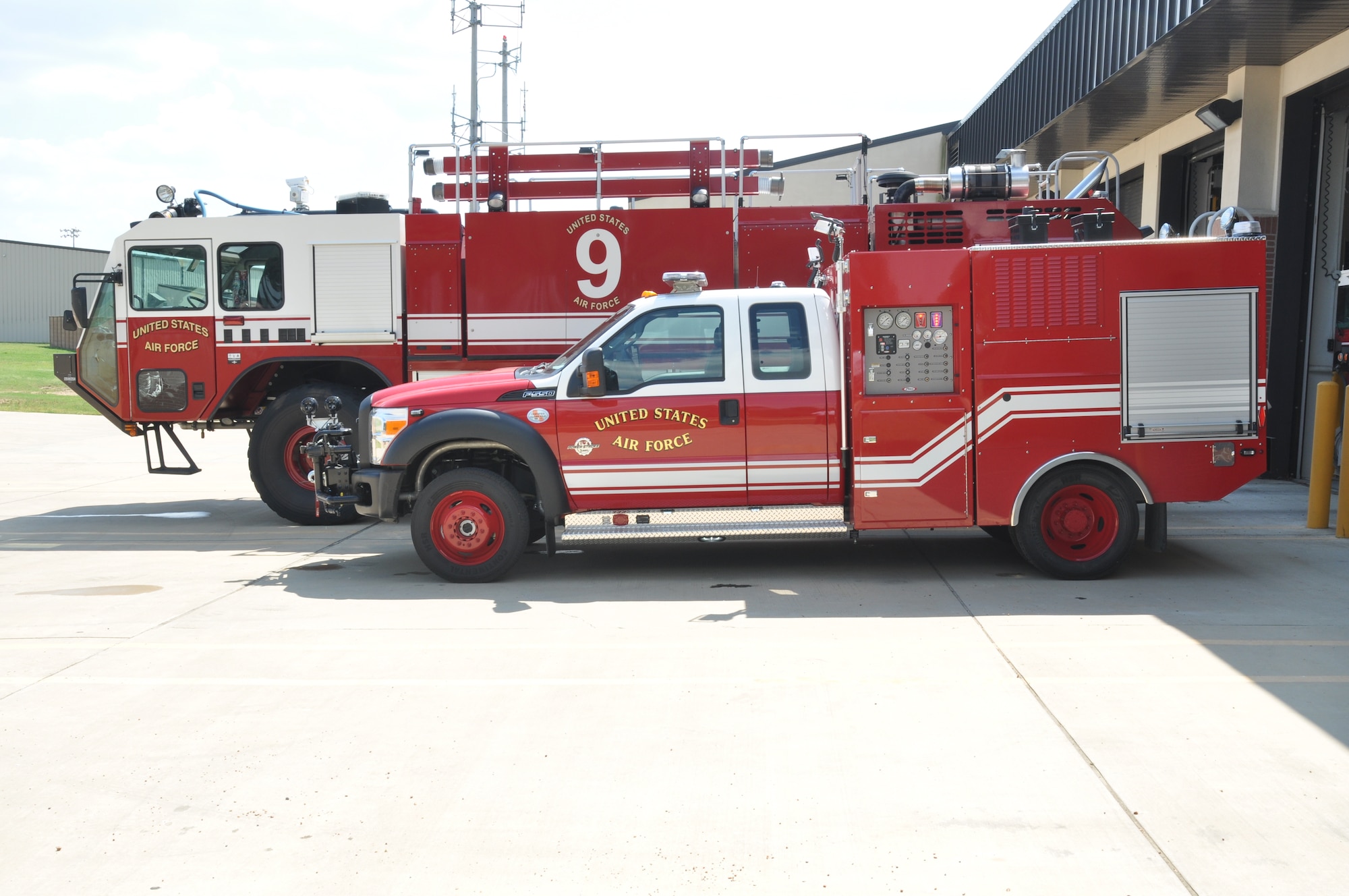 The new P34 Rapid Intervention Vehicle sits next to one of Columbus Air Force Base’s current fire engines.  The P34 RIV is a high-pressure fire engine that uses a fraction of the water capacity of previous trucks combined with fire-fighting foam for much higher resource efficiency.  (U.S. Air Force Photo/Airman 1st Class Charles Dickens)