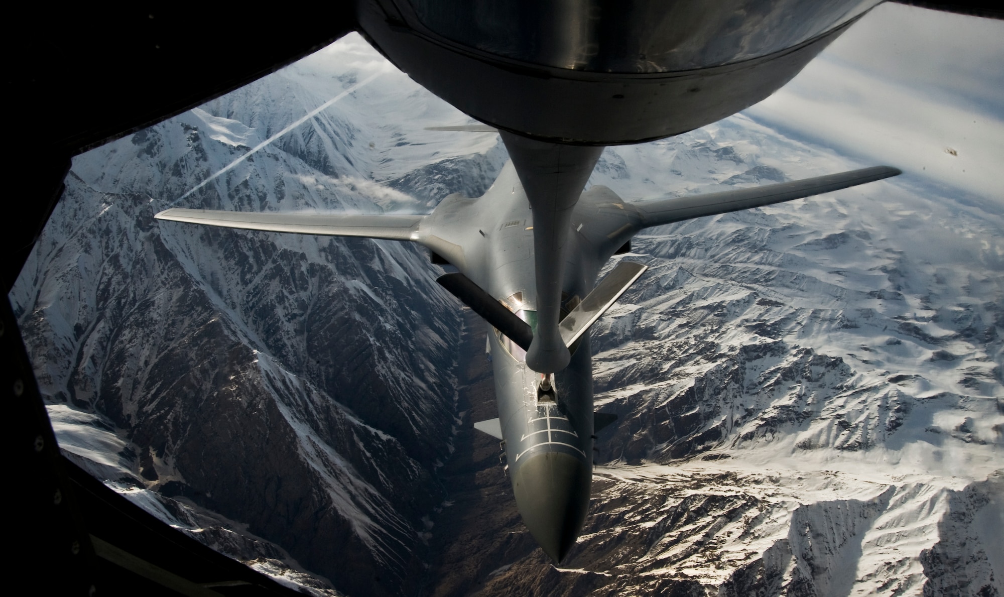 A B1-B Lancer receives fuel from a KC-135 Stratotanker over Afghanistan April 9, 2012. The B1-B received 85,000 pounds of fuel; it can carry up to 265,274 pounds. The B1-B Lancer is deployed from Dyess Air Force Base, Texas, and the KC-135 Stratotanker is deployed to the Transit Center at Manas, Kyrgyzstan, from McConnell AFB, Kan. (U.S. Air Force photo/Staff Sgt. Angela Ruiz)