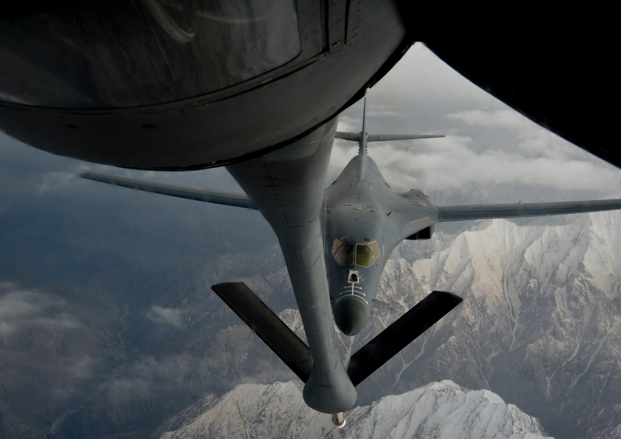 A B1-B Lancer approaches a KC-135 Stratotanker for an aerial refueling over Afghanistan April 9, 2012. The B1-B Lancer can fly more than 900 miles per hour and is deployed from Dyess Air Force Base, Texas. The KC-135 Stratotanker is deployed to the Transit Center at Manas, Kyrgyzstan,from McConnell Air Force Base, Kan. (U.S. Air Force photo/Staff Sgt. Angela Ruiz)