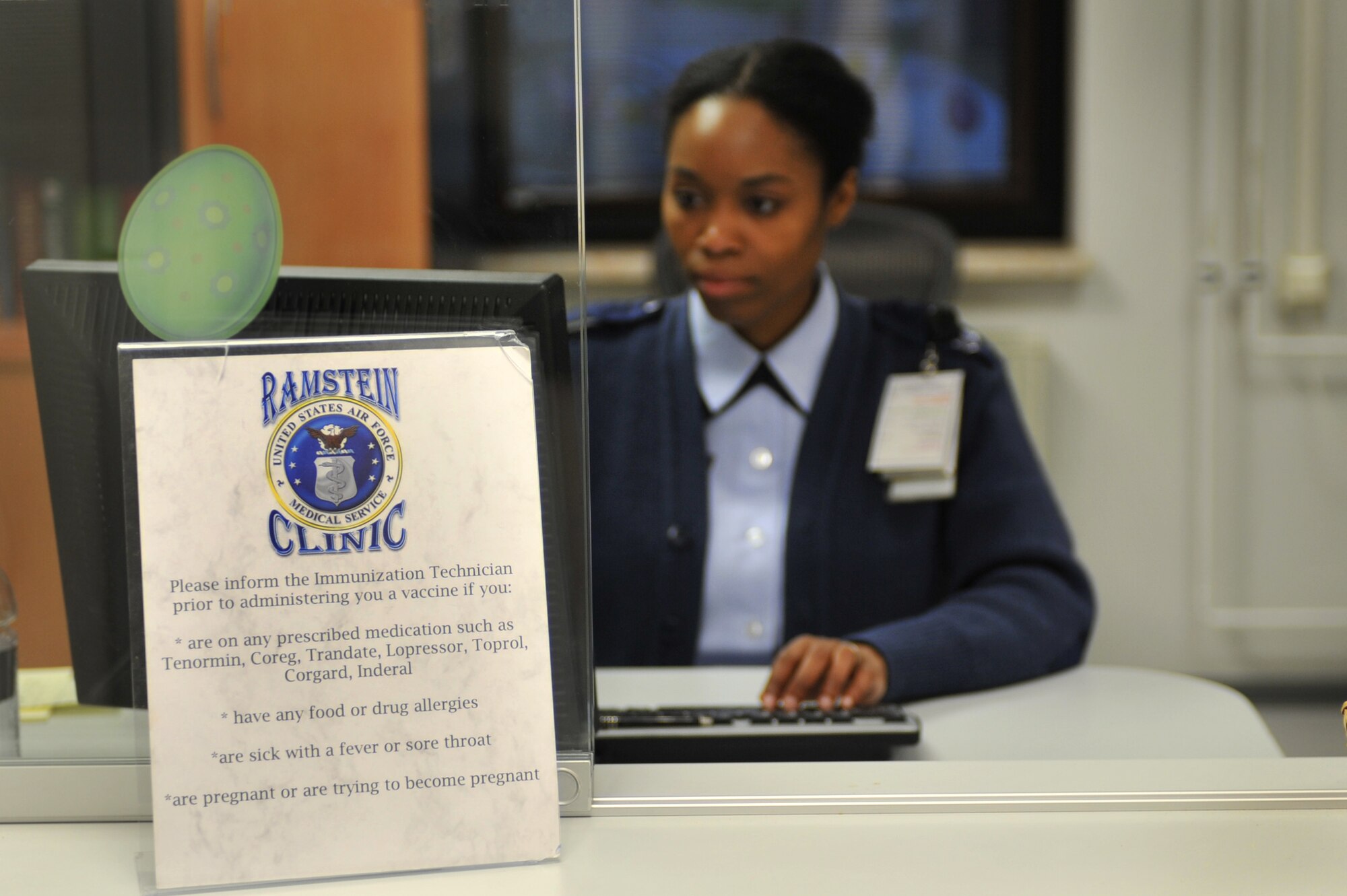 Staff Sgt. Dawn Samuel, 86th Medical Group, attends the customer service desk in the immunization section of the clinic on Ramstein Air Base, April 16, 2012. As an Air Force Smart Operations of the 21st Century initiative, the implemented changes allow clinic staff to work more efficiently and better serve customers. (U.S. Air Force photo/ Airman 1st Class Caitlin O'Neil-McKeown)   