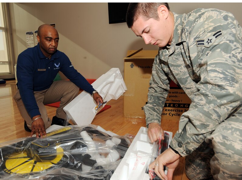 MINOT AIR FORCE BASE, N.D. – Airman 1st Class Kurt Russell, 5th Force Support Squadron fitness apprentice, and Tech. Sgt. Kendall Mills, 5th FSS non-commissioned officer in charge of the fitness center, assemble a brand new Livestrong Spinning Bike at the McAdoo Sports and Fitness Center April 10. (U.S. Air Force photo/Senior Airman Jose L. Hernandez)

 
 

