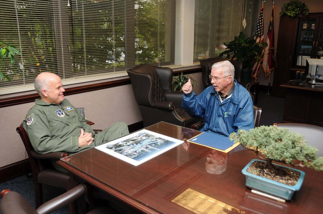 Charlotte, N.C. - Brig. Gen. Tony McMillan, Commander of the 145th Airlift Wing in Charlotte, N.C. , discusses military life of yesteryear with Col. (retired) Edmund C. Morrisey, Jr. in his office. Morrisey, the first Commandant of the Noncommissioned Officer Academy, McGhee Tyson Air National Guard (ANG) Base, Tennessee, spoke to the Noncommissioned Officer Academy Graduates Association of North Carolina (Chapter 7). (Photo by Tech. Sgt. Rich Kerner, 145 AW Public Affairs)