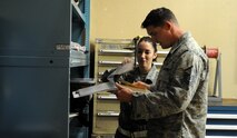 Pacific Air Forces Inspector General team member Master Sgt. Kevin Charrier, right, ensures the Air Force Technical Order 350 tag matches the repairable and broken parts that Staff Sgt. Katherine Andrews, 80th Aircraft Maintenance Unit support, has listed, April 16, 2012, on Kunsan Air Base, Republic of Korea. Maintenance support sections require a high attention to detail because of the volume and importance of each part. (U.S. Air Force photo/Senior Airman Brigitte N. Brantley)