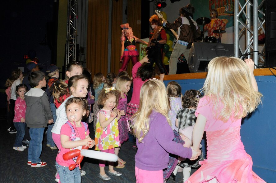 Children dance and jump around to the live music of The Party Animals at Misawa Air Base, Japan, April 15, 2012. The Party Animals performed at Misawa Air Base as part of an Armed Forces Entertainment show for The Month of the Military Child. The Party Animals performed at Misawa Air Base as part of an Armed Forces Entertainment show for The Month of the Military Child. (U.S. Air Force photo by Tech. Sgt. Marie Brown/Released) 

