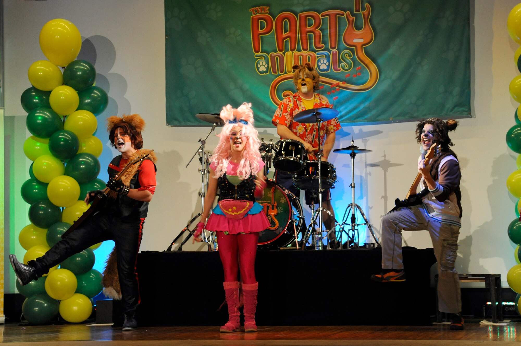 The Party Animals perform for Misawa families during one of their three shows at Misawa Air Base, Japan, April 15, 2012. The Party Animals concert is an interactive rock and roll musical for the whole family. The Party Animals performed at Misawa Air Base as part of an Armed Forces Entertainment show for The Month of the Military Child. (U.S. Air Force photo by Tech. Sgt. Marie Brown/Released)
