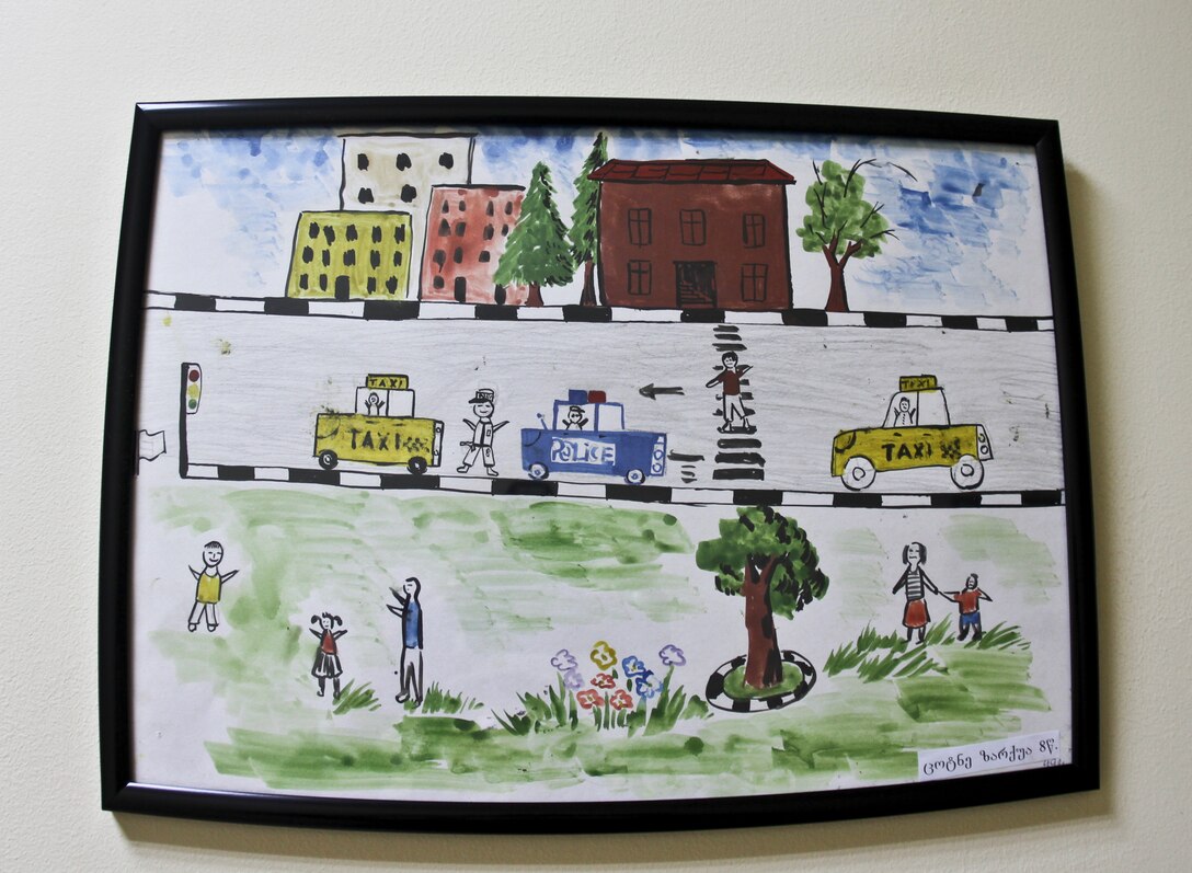 TBLISI, Republic of Georgia — The hallways in the three-story classroom-dorm room building at the Tbilisi Police Academy in Georgia are adorned with art drawn by area children to express their pride for the police force.
