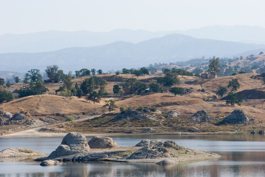 Hensley Lake is framed by a series of receding hills.