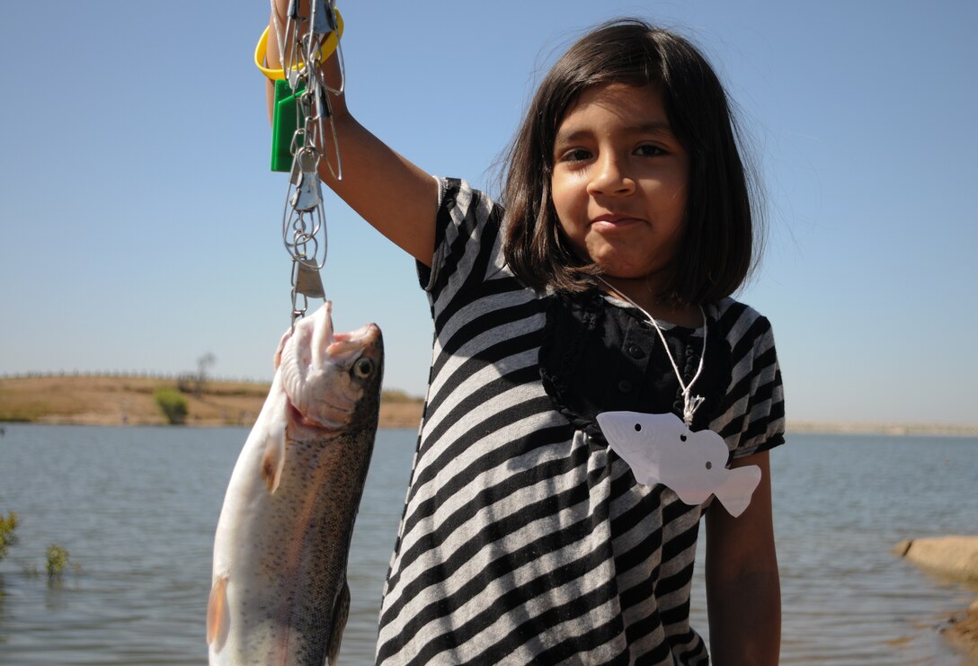 Daniella Bueno shows off her catch during the 15th annual Kids Fishing Day.
