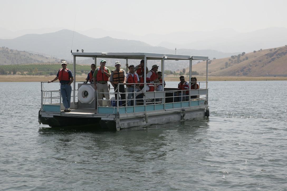 A pontoon workboat launches onto Lake Success.