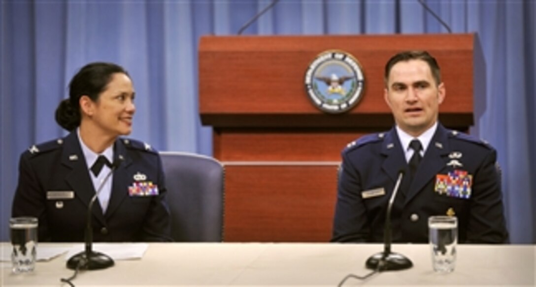 Lt. Col Nahaku McFadden (left) of the Maryland Air National Guard introduces Capt. Barry F. Crawford Jr. to the Pentagon press corps on April 11, 2012.  Crawford was awarded the Air Force Cross for his heroism during his service as a Special Tactics Officer while deployed to Afghanistan.  On May 4, 2010, Crawford was instrumental in saving the lives of three Afghan soldiers and evacuating two Afghans killed in action.  