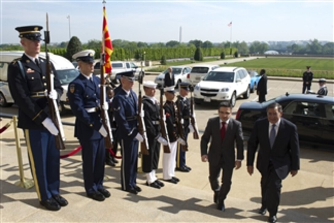Secretary of Defense Leon E. Panetta escorts the Defense Minister of Macedonia Fatmir Besimi through an honor cordon and into the Pentagon on April 16, 2012.  
