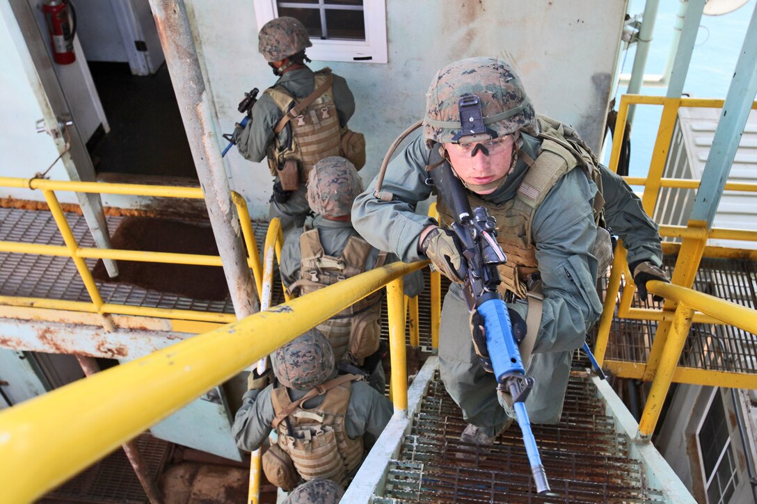 Marines from the 15th Marine Expeditionary Unit’s Maritime Raid Force ascend the stairwell of an oil platform off the coast of Carpinteria, Calif., April 16. The MRF practiced gas and oil platform raids during the week-long maritime portion of Realistic Urban Training. The exercise prepares the Marines for a new and unfamiliar environment and further enhances their skill sets.