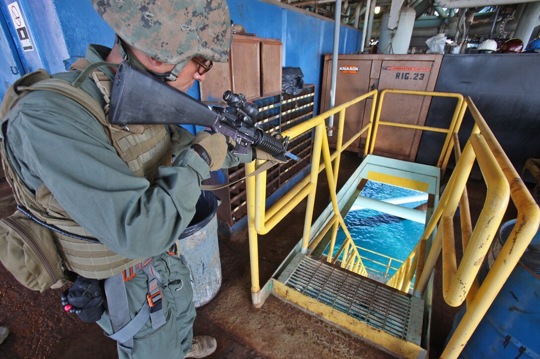 Private First Class, Andrew C. Newark, rifleman, Security Platoon, Battalion Landing Team 3/5, Maritime Raid Force, 15th Marine Expeditionary Unit, provides security on an oil platform off the coast of Carpinteria, Calif., April 16. The MRF practiced gas and oil platform raids during the week-long maritime portion of Realistic Urban Training. The exercise prepares the Marines for a new and unfamiliar environment and further enhances their skill sets.::r::::n:: (U.S. Marine Corps photo by Lance Cpl. Timothy Childers)::r::::n::