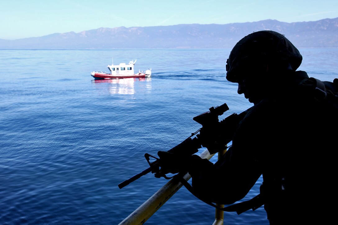 A Marine from the 15th Marine Expeditionary Unit’s Maritime Raid Force provides security on an oil platform off the coast of Carpinteria, Calif., April 16. The MRF practiced gas and oil platform raids during the week-long maritime portion of Realistic Urban Training. The exercise prepares the Marines for a new and unfamiliar environment and further enhances their skill sets.::r::::n::(U.S. Marine Corps photo by Lance Cpl. Timothy Childers)::r::::n::