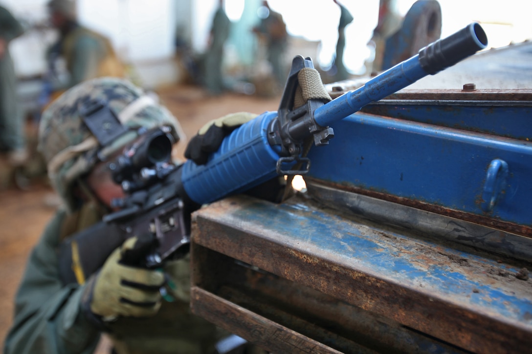A Marine from the 15th Marine Expeditionary Unit’s Maritime Raid Force provides security on an oil platform off the coast of Carpinteria, Calif., April 16. The MRF practiced gas and oil platform raids during the week-long maritime portion of Realistic Urban Training. The exercise prepares the Marines for a new and unfamiliar environment and further enhances their skill sets.::r::::n:: (U.S. Marine Corps photo by Lance Cpl. Timothy Childers)::r::::n::