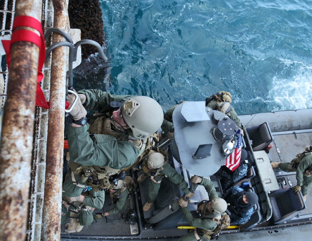Marines from the 15th Marine Expeditionary Unit’s Maritime Raid Force climb a caving ladder to the bottom of an oil platform off the coast of Carpinteria, Calif., April 16. The MRF practiced gas and oil platform raids during the week-long maritime portion of Realistic Urban Training. The exercise prepares the Marines for a new and unfamiliar environment and further enhances their skill sets.   (U.S. Marine Corps photo by Lance Cpl. Timothy Childers)