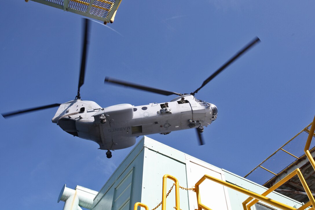 A CH-46E from Marine Medium Helicopter Squadron 364, hovers above an oil platform off the coast of Carpinteria, Calif., April 16, supporting the 15th Marine Expeditionary Unit’s Maritime Raid Force. The MRF practiced gas and oil platform raids during the week-long maritime portion of Realistic Urban Training. The exercise prepares the Marines for a new and unfamiliar environment and further enhances their skill sets.::r::::n:: (U.S. Marine Corps photo by Lance Cpl. Timothy Childers)::r::::n:: 	::r::::n::