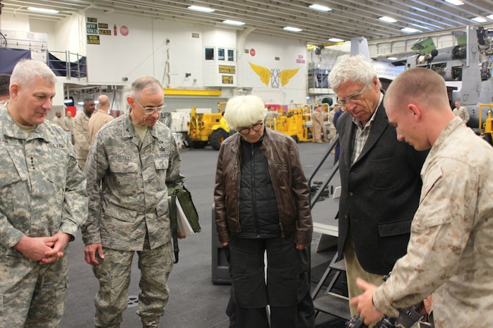 Cpl. Corey Froemming, right, a rifleman with Bravo Company, Battalion Landing Team, 1st Battalion, 2nd Marine Regiment, 24th Marine Expeditionary Unit, explains an M203 grenade launcher to Ambassador Sam Kaplan, the U.S. ambassador to the Kingdom of Morocco, and Army Gen. Carter Ham, far left, the commander of U.S. African Command, during a visit aboard the ship here, April 16, 2012, in the final days of Exercise African Lion 12. African Lion is a bi-lateral training exercise between U.S. forces, including the 24th MEU, and Royal Moroccan Armed Forces to promote partnership and mutual understanding between each nation’s militaries. The 24th MEU, along with the Iwo Jima Amphibious Ready Group, is currently deployed as a theater security and crisis response force capable of a variety of missions from full-scale combat to humanitarian assistance and disaster relief.