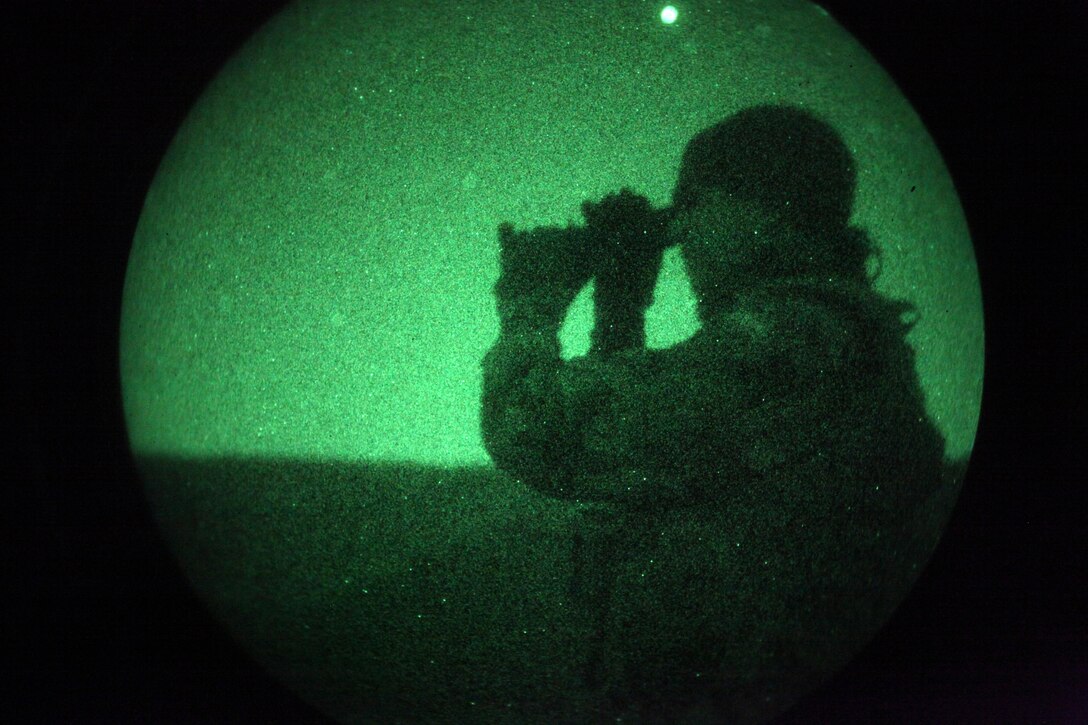 An infantryman with the Spanish Marine Corps looks though a night vision optic during bi-lateral tactics training between the 24th Marine Expeditionary Unit and the Spanish Marine Corps. The 24th MEU, partnered with the Navy's Iwo Jima Amphibious Ready Group, is deployed to the European and Central Command theaters of operation to serve as a theater reserve and crisis response force capable of a variety of missions from full-scale combat operations to humanitarian assistance and disaster relief.