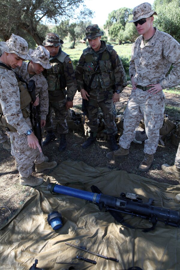Cpl. Juan Vidana, a mortarman with Charlie Company, Battalion Landing Team 1st Battalion, 2nd Marine Regiment, 24th Marine Expeditionary Unit, and an infantryman with the Spanish Marine Corps switch weapons, during bi-lateral tactics training between the 24th Marine Expeditionary Unit and the Spanish Marine Corps. The 24th MEU, partnered with the Navy's Iwo Jima Amphibious Ready Group, is deployed to the European and Central Command theaters of operation to serve as a theater reserve and crisis response force capable of a variety of missions from full-scale combat operations to humanitarian assistance and disaster relief.