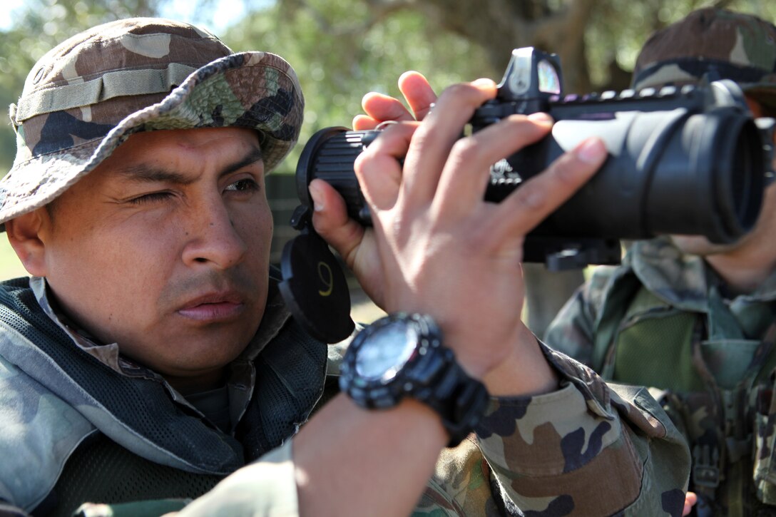 An infantryman with the Spanish Marine Corps looks through an MDO, a machine gun optic, April 16, here, during bi-lateral tactics training between the 24th Marine Expeditionary Unit and the Spanish Marine Corps. The 24th MEU, partnered with the Navy's Iwo Jima Amphibious Ready Group, is deployed to the European and Central Command theaters of operation to serve as a theater reserve and crisis response force capable of a variety of missions from full-scale combat operations to humanitarian assistance and disaster relief.