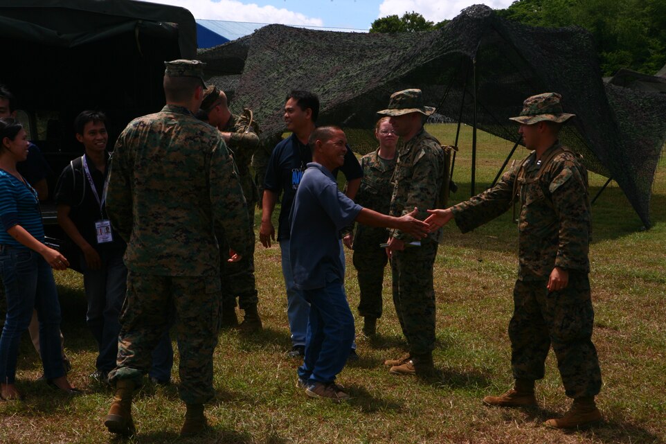 Nathaniel T. Rodriguez asks U.S. air operation Marines questions about their air traffic control equipment on Antonio Bautista Air Base on Puerto Princesa April 17, 2012. The career counterparts are jointly conducting air traffic control for the duration of Balikatan 2012 (BK12) Task Force Palawan. BK12 is a bilateral, joint exercise conducted annually between the U.S. and the Republic of the Philippines. This year marks the 28th iteration of the nations' exercise.