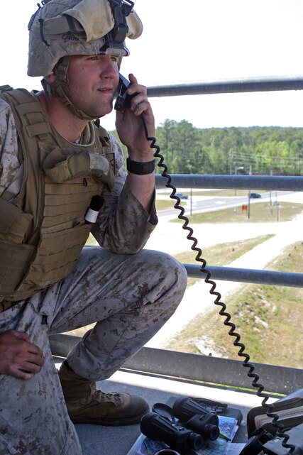 Corporal Mason Robertson, a fire support man with Headquarters Battery, 3rd Battalion, 10th Marine Regiment, watches for the strike of the artillery fire order he just called in during a recent battalion training exercise.  The Mt. Airy, Md., native with 2nd Marine Division and his fellow fire support Marines spent the week practicing fire orders for everything from artillery and mortars to close air support and even naval gun fire as they prepare for upcoming deployments to Afghanistan and future deployments with the 26th Marine Expeditionary Unit. (Official U.S. Marine Corps photo by Lance Cpl. James Frazer)