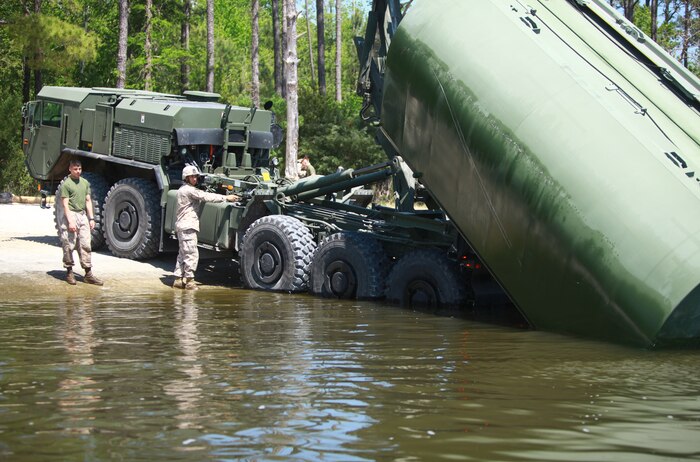 Marines with 8th Engineer Support Battalion, 2nd Marine Logistics Group raise a raft out of water during a bridging exercise at Engineer Point aboard Camp Lejeune, N.C., April 17, 2012. During the exercise, the battalion tested their bridging abilities by transporting vehicles across a large body of water and provided training for several Marine Corps reservists with Bridge Company Bravo, 6th ESB from Folsom, Pa. (U.S. Marine Corps photo by Pfc. Franklin E. Mercado)