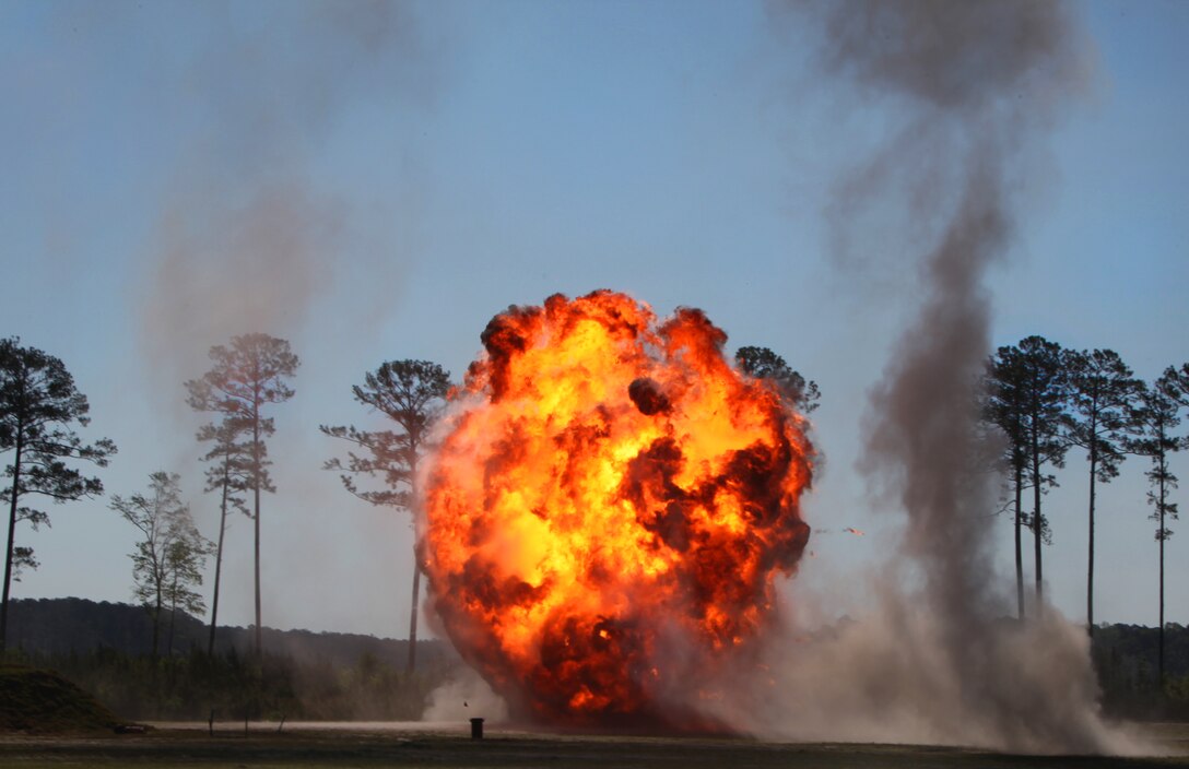 A fire-ball erupts from a controlled explosion conducted by explosive ordnance disposal Marines April 17, 2012, at the EOD range aboard Marine Corps Air Station Cherry Point, N.C. The Marines executed a down-sized practice run creating a 30-foot wall of fire and detonating other explosives at the station ordnance disposal range. The Cherry Point Marines plan to put on a big bang and ignite a 1,000 foot wall of fire for the 150,000 spectators expected at the 2012 MCAS Cherry Point Air Show May 4 – 6.