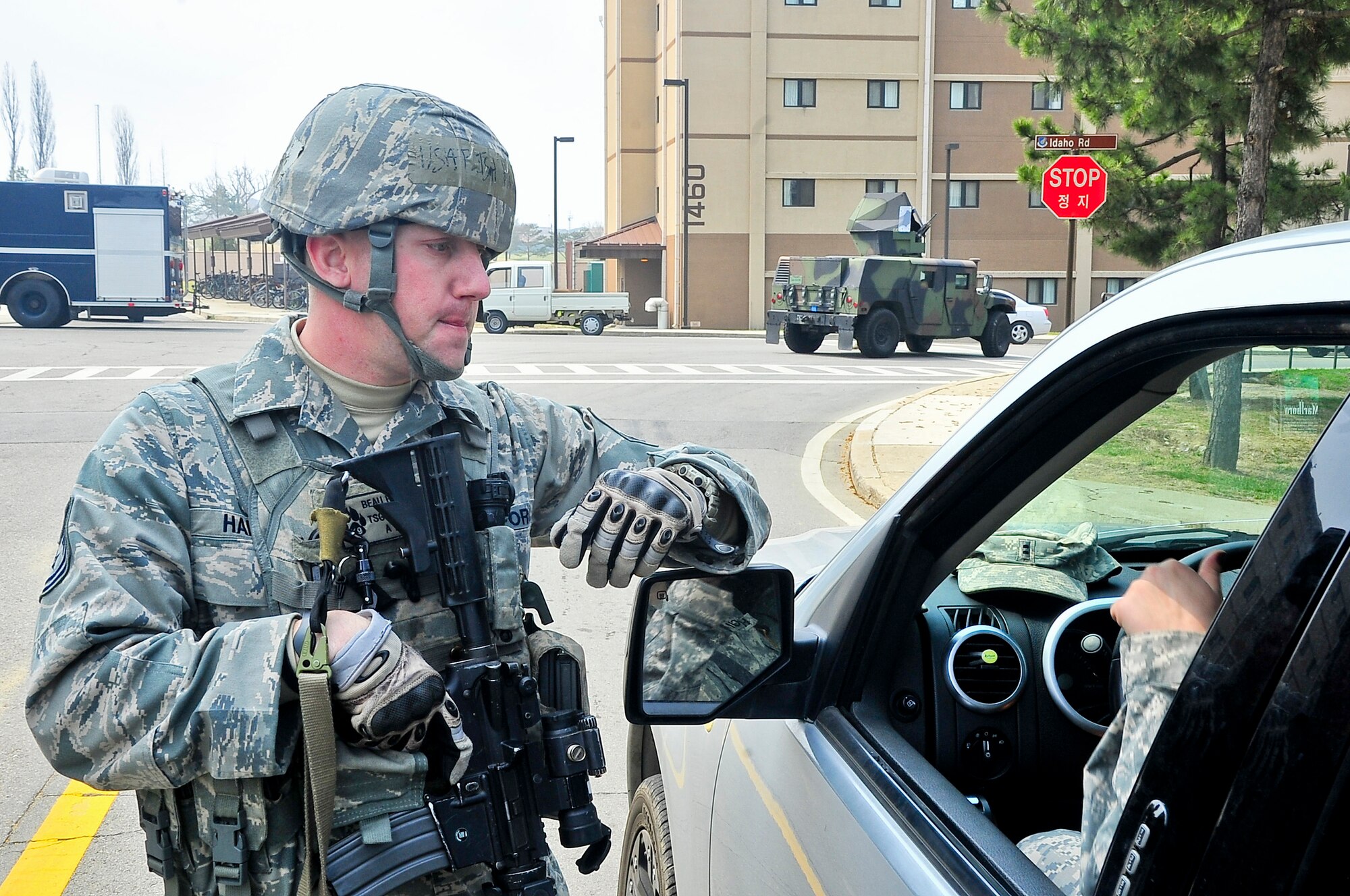 Tech. Sgt. Beau Hansen, 51st Security Forces Squadron flight chief, directs traffic during an Emergency Management Inspection here April 16, 2012. Hansen also maintained control over the cordons while ensuring all unauthorized personnel were detained and escorted out of their area of responsibility. (U.S. Air Force photo/Senior Airman Adam Grant)