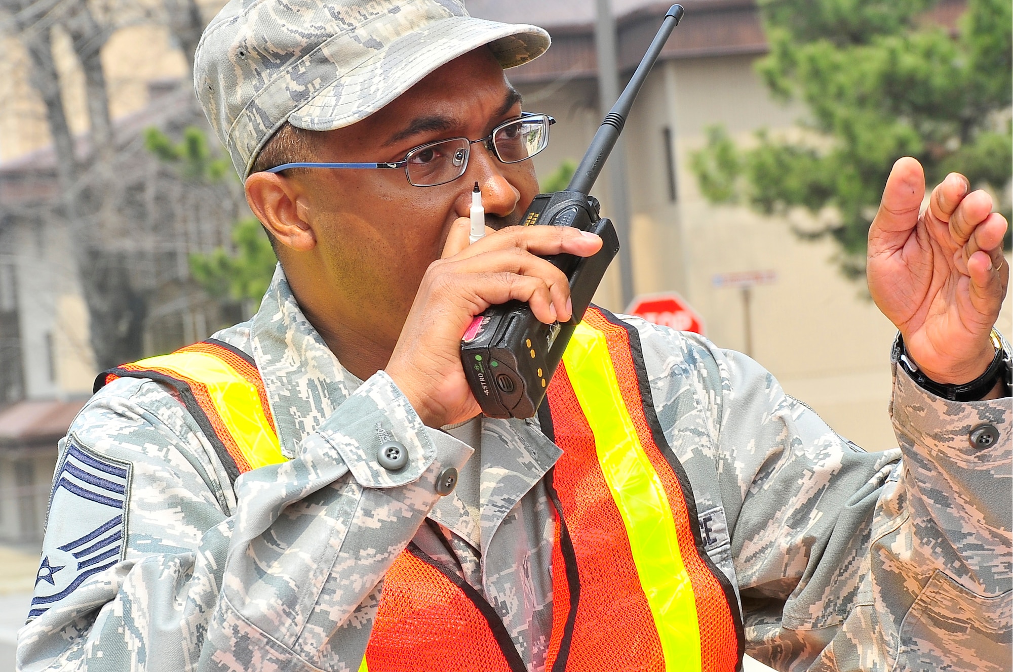 Chief Master Sgt. Reco Houston, 51st Civil Engineer Squadron fire chief, directs movement of troops during the Emergency Management Inspection here April 16, 2012. During the inspection Houston was the incident commander and controlled all actions of emergency responders. (U.S. Air Force photo/Senior Airman Adam Grant)
