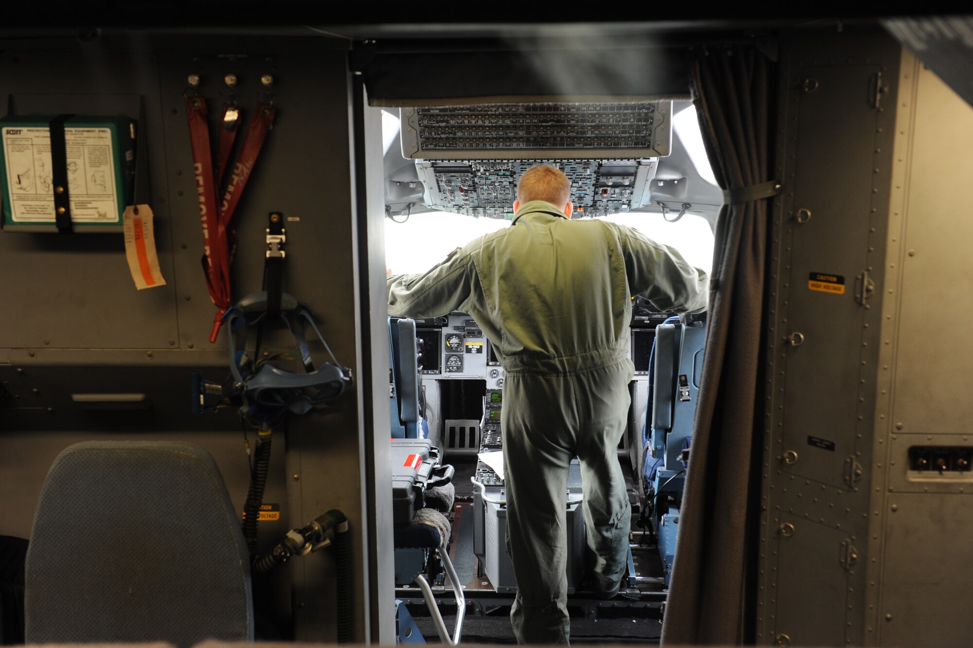 Staff Sgt. Jason Chaltry, 15th Aircraft Maintenance Squadron flying crew chief, performs pre-flight maintenance on a C-17 Globemaster III from the 535th Airlift Squadron at Joint Base Pearl Harbor Hickam, Hawaii, April 6 at Andersen Air Force Base, Guam, while on a five-day mission to fly, execute airdrops, and foster joint service and international operability in the Pacific theater. During the mission, the aircrew dropped static-line personnel, heavy equipment platforms, high-velocity container delivery system bundles, low-velocity CDS bundles, and High-Altitude Low-Opening jumpers during their time in Guam. (U.S. Air Force photo by Staff Sgt. Nathan Allen)